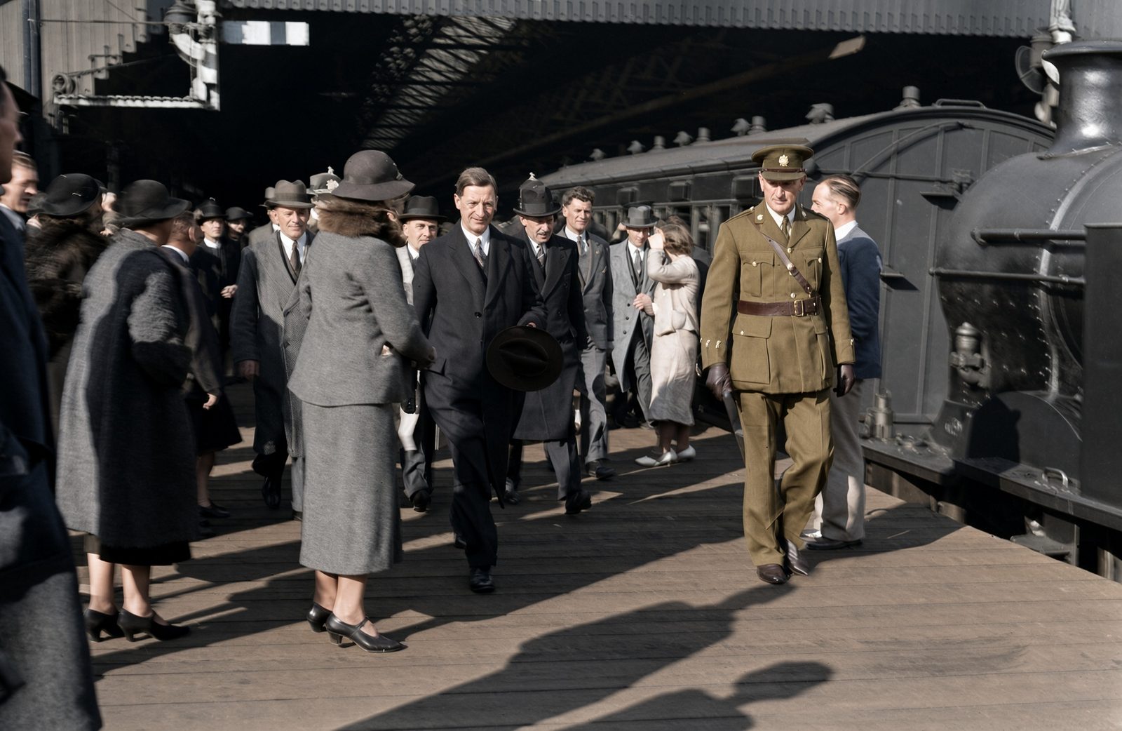 Éamon de Valera walks along a crowded railway platform at Westland Row station in Dublin.
